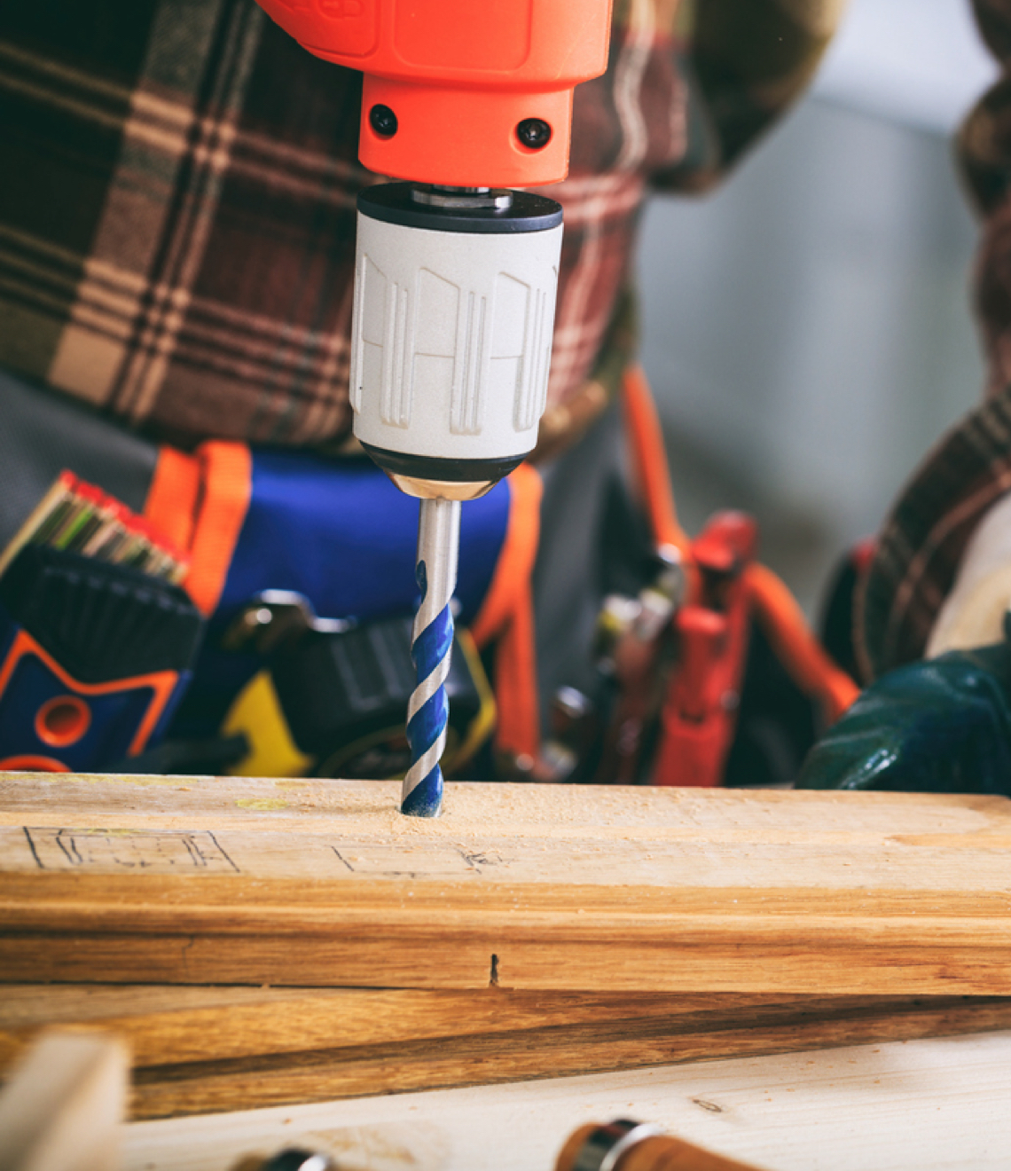 power drill on wood plank